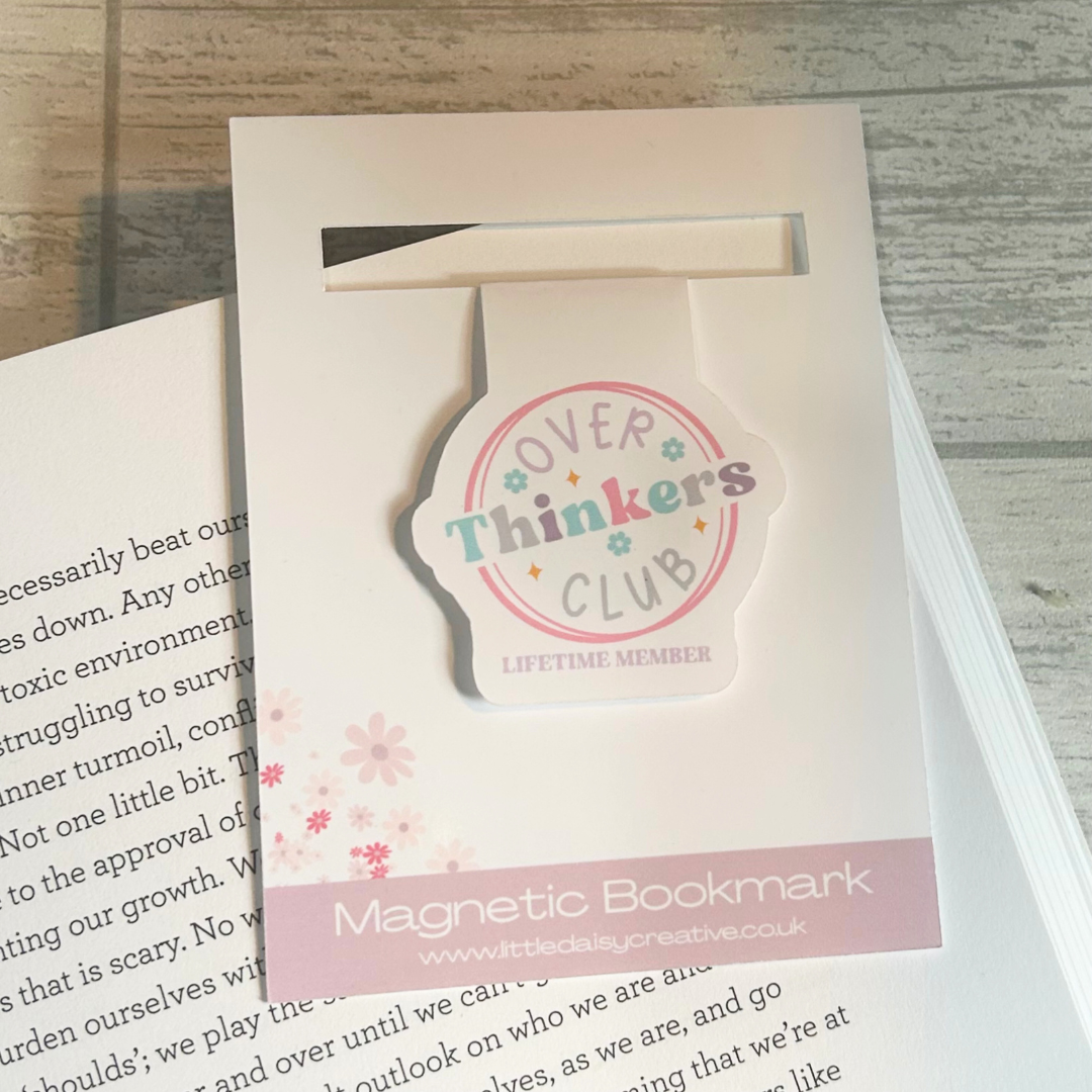 White gloss magnetic bookmark with Overthinkers Club Logo on display card.