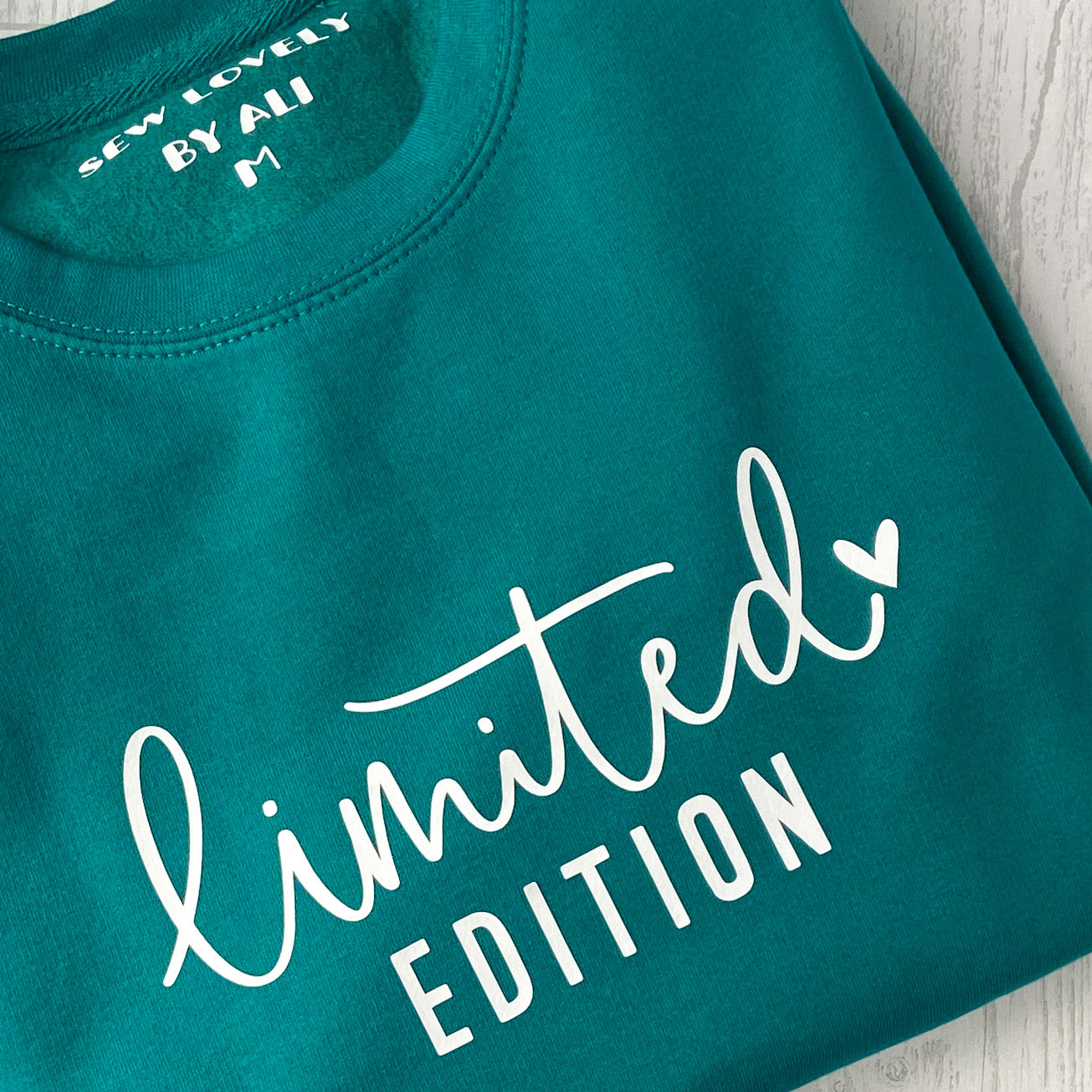 Jade crew neck sweatshirt with white wording that reads 'Limited Edition'.