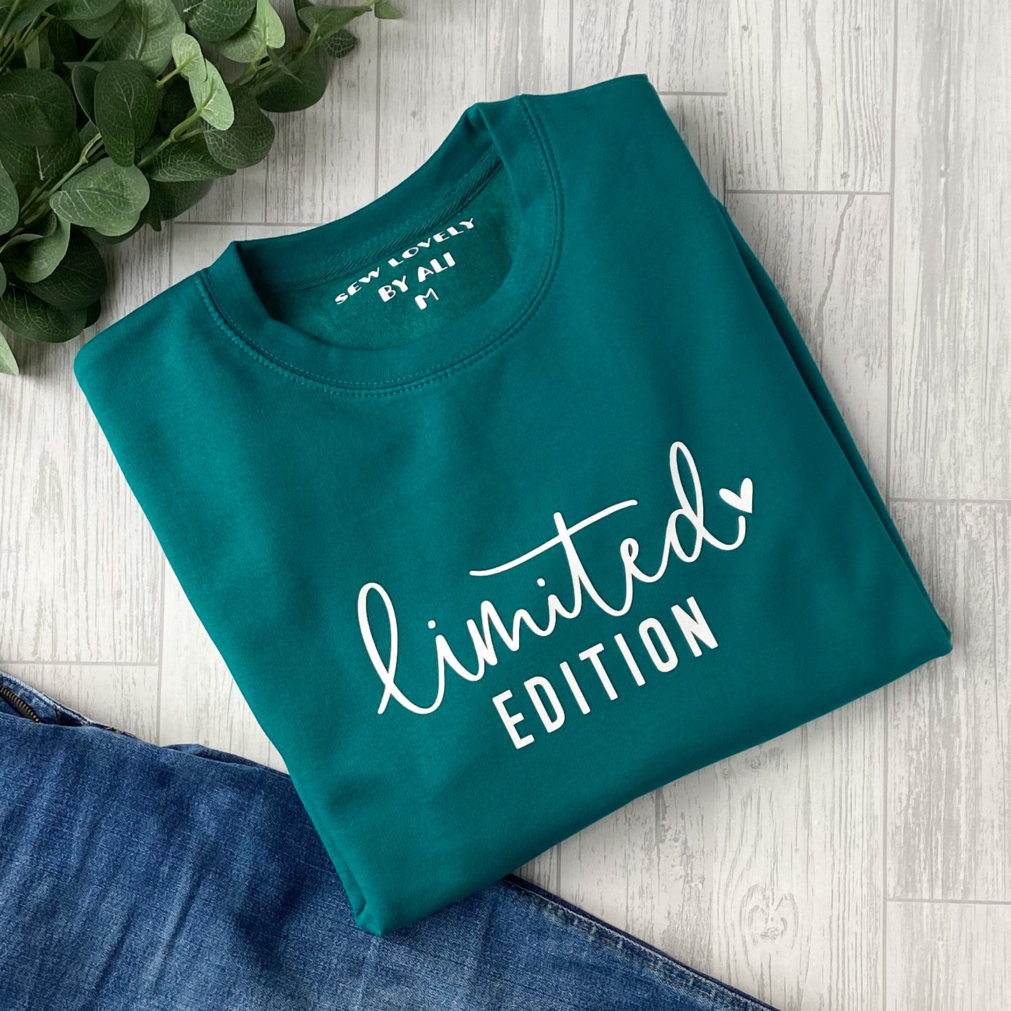 Jade crew neck sweatshirt with white wording that reads 'Limited Edition'.