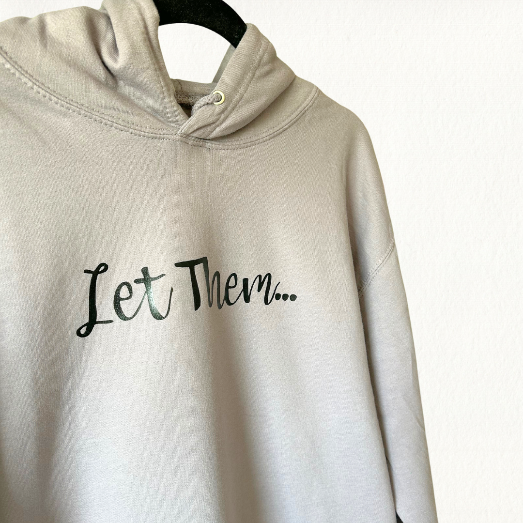 Let Them Hoodie in Dusty Lilac with black lettering on front and sleeve