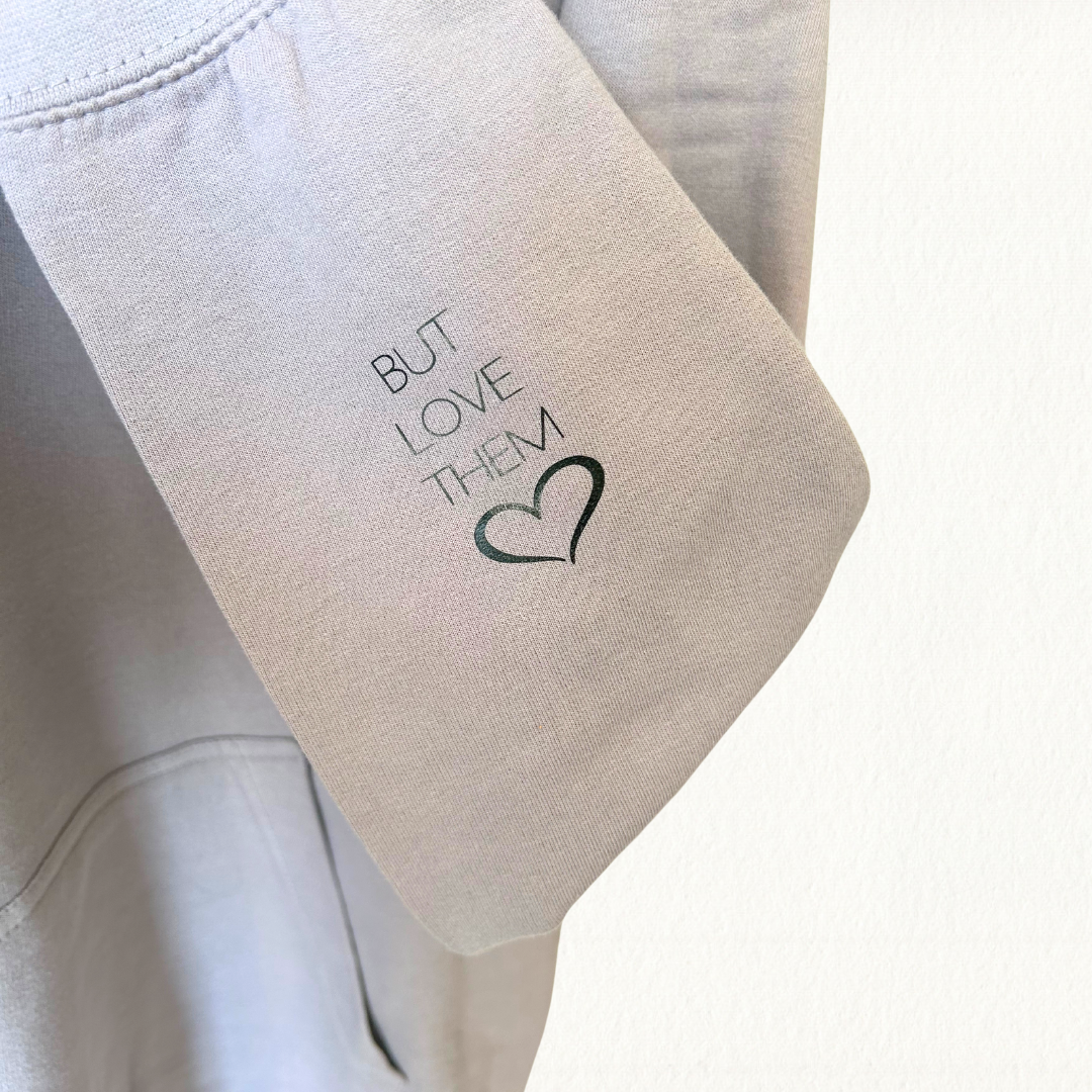 Let Them Hoodie in Dusty Lilac with black lettering on front and sleeve
