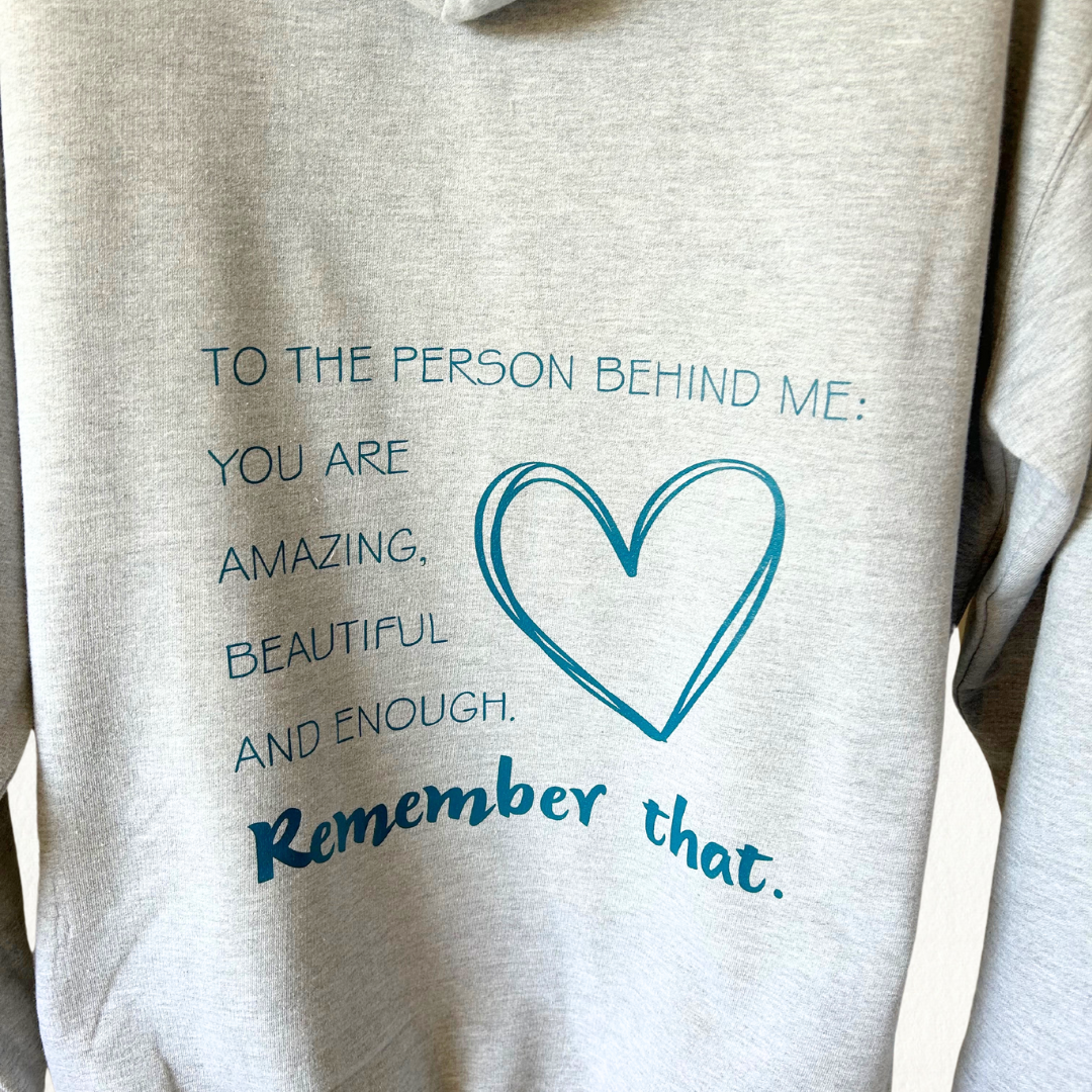 Heather grey hoodie with teal wording on the back with heart detail